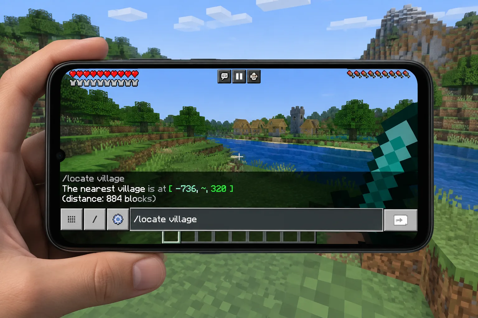 Nhập lệnh tìm làng trong Minecraft PE trên màn hình điện thoại Android